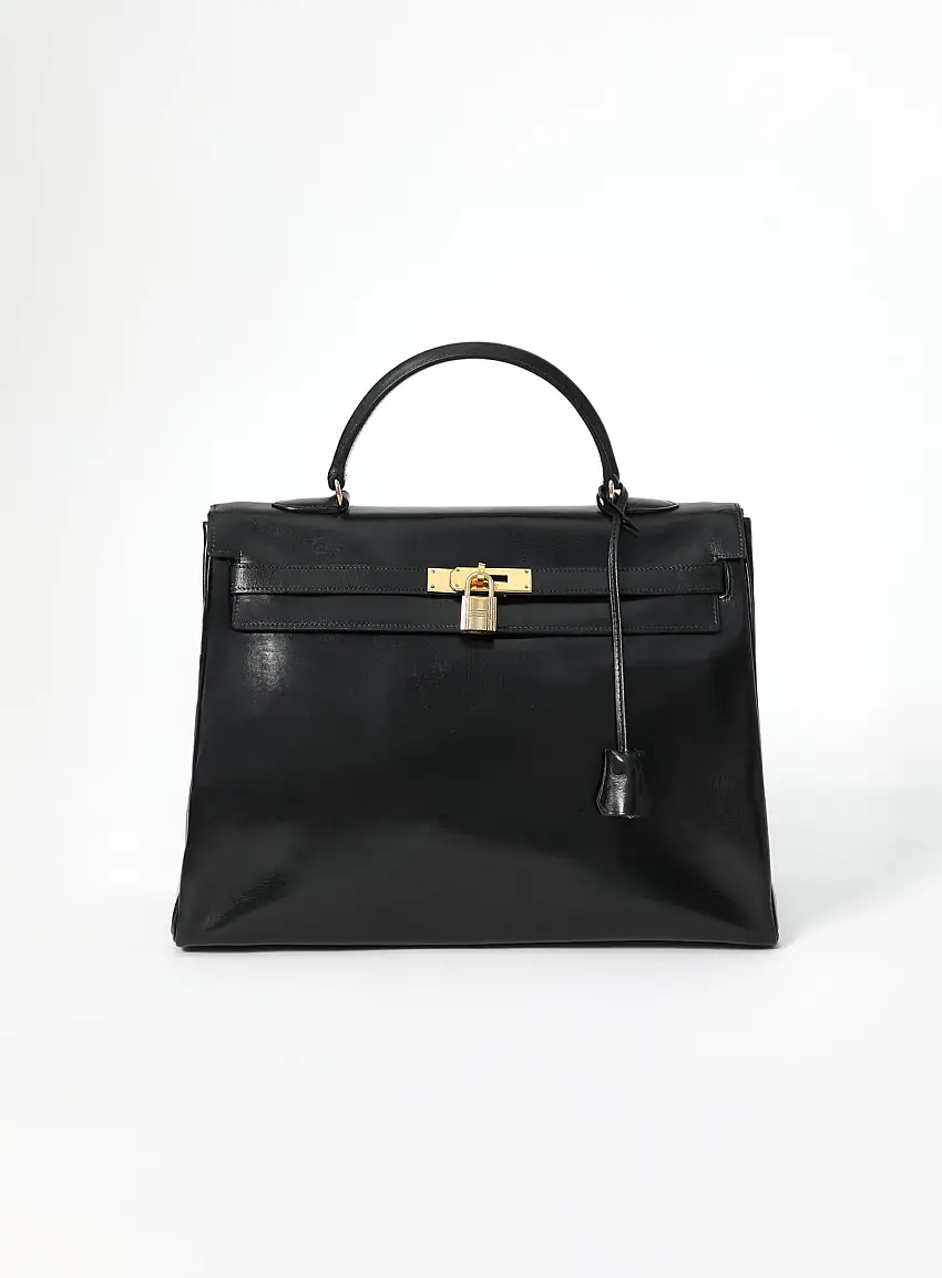 31cf7f8b6fcc6fcf7db979de07f2-1 '60s Kelly Retourné 35 Box Noir | Authentique & Vintage